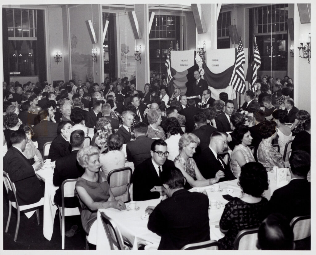 Historical black and white photo of the 15th anniversary dinner of the United States Educational Foundation in Belgium.