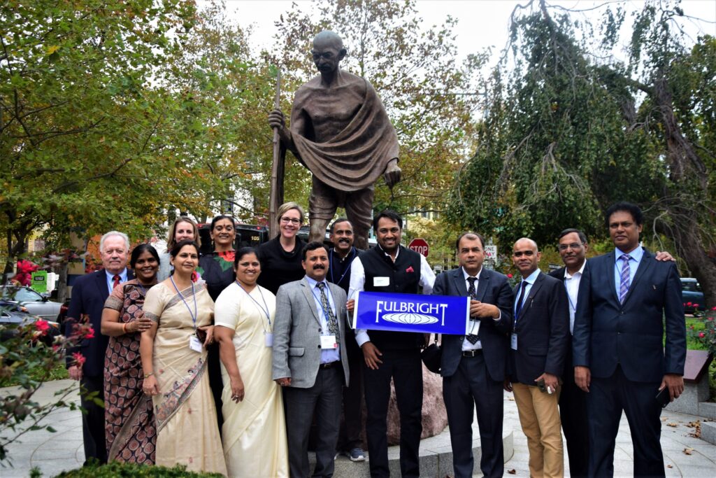 2018 Fulbright-Nehru International Educational Administrators Program participants from India pose with the statue of Mahatma Gandhi at the Embassy of India, in Washington D.C.