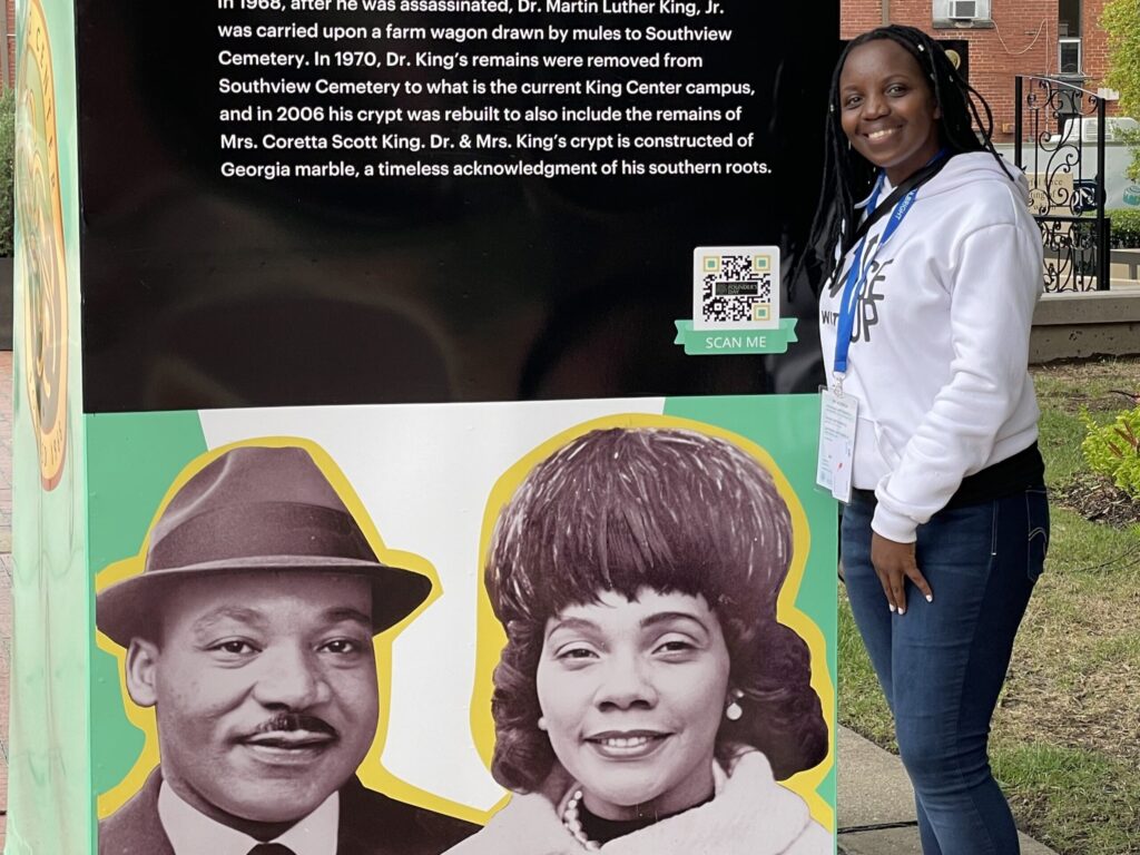 Jeanne standing by sign about Martin Luther King