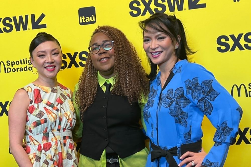 Sumalee Montano standing in front of SXSW sign with two women