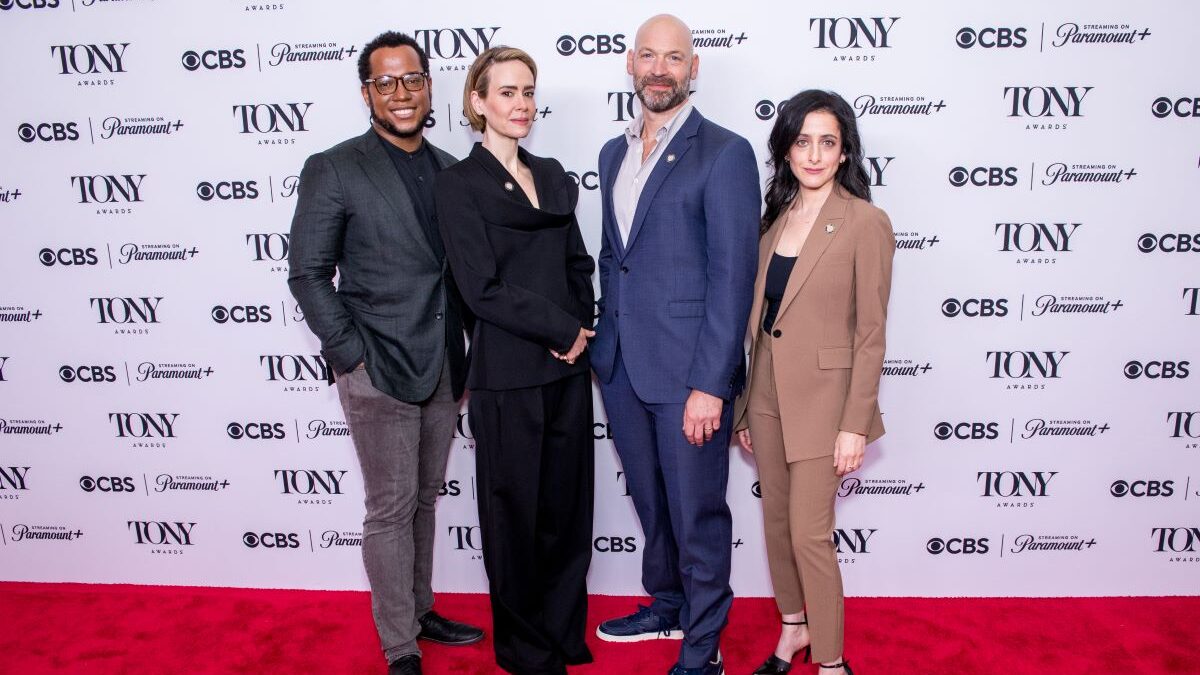 Branden Jacobs-Jenkins standing with other Tony Award nominees in front of step and repeat