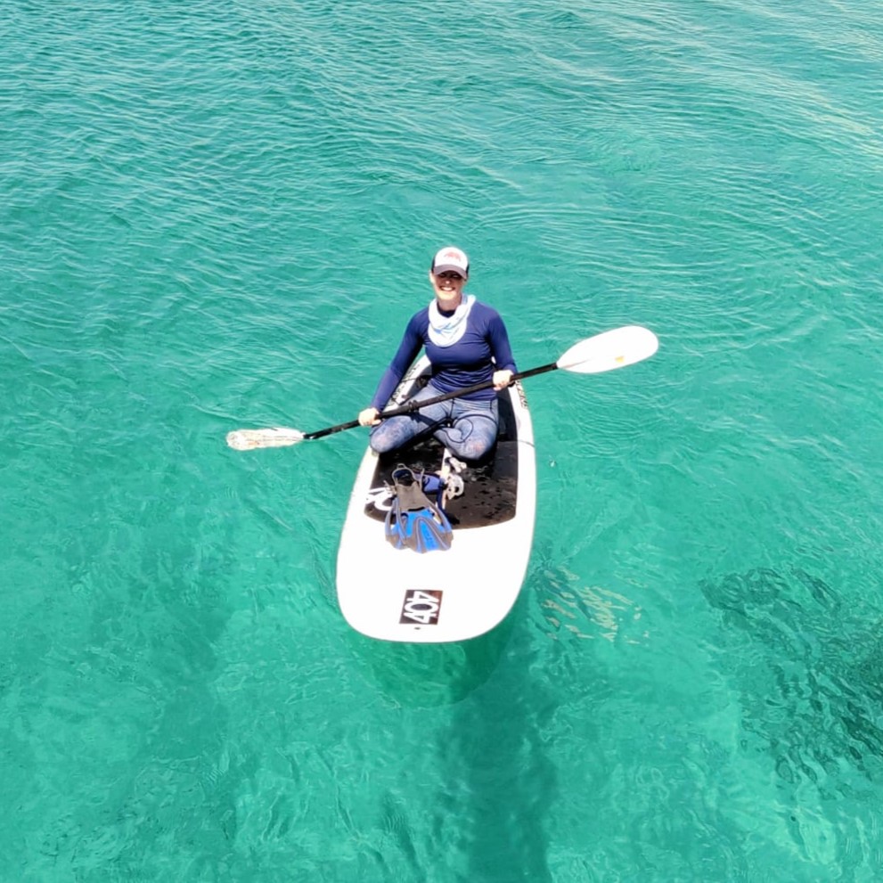 Women sitting on kayak in sea