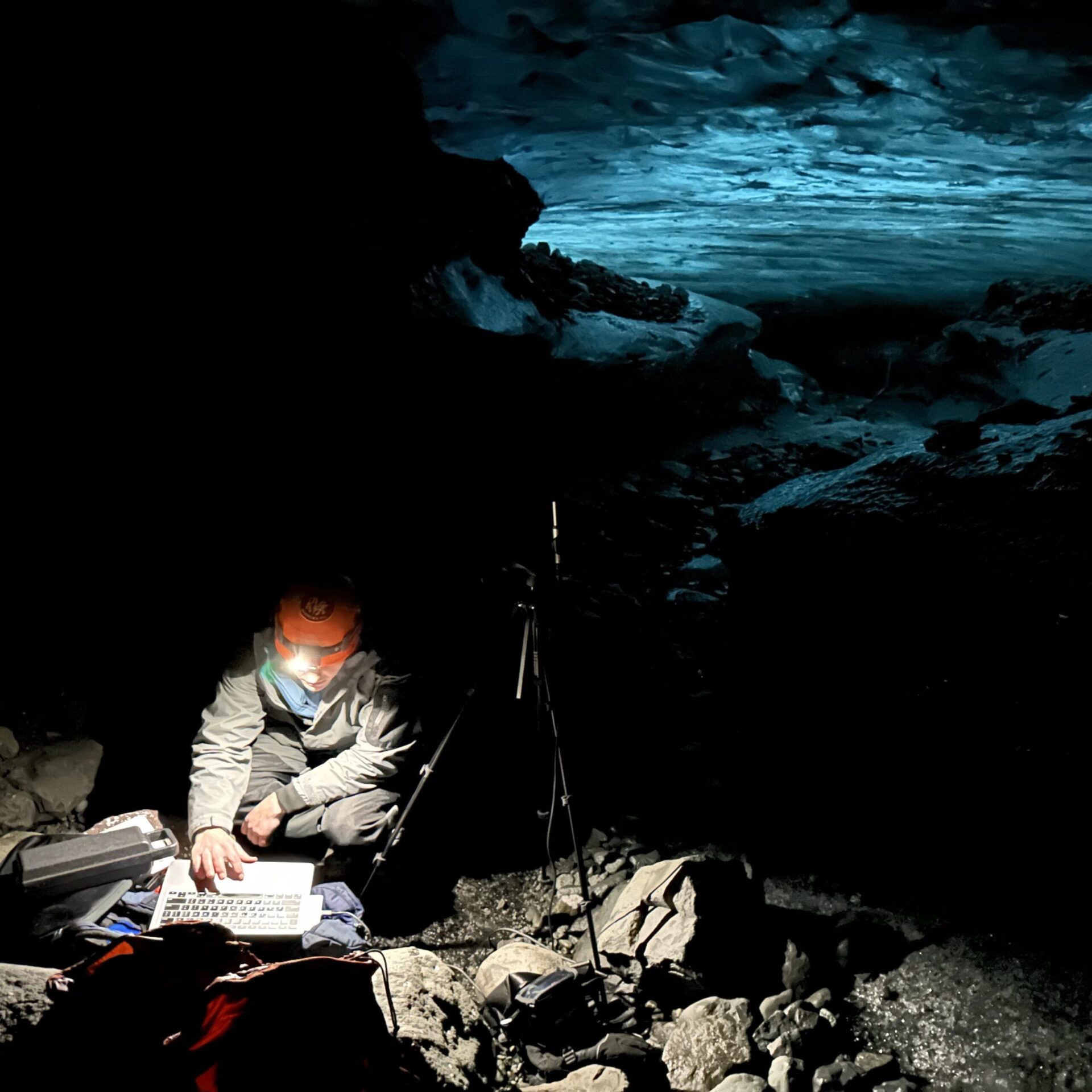 Konstatine Vlasis working in the dark on laptop outside