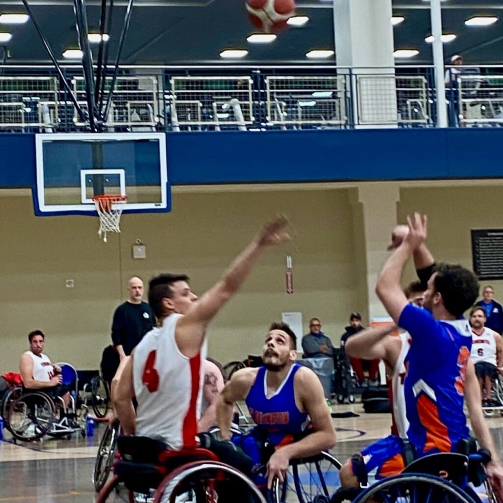 Men in wheelchairs playing basketball