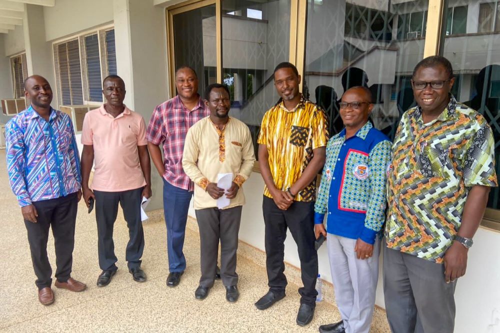 Karl Jackson standing with group faculty at Cape Coast University