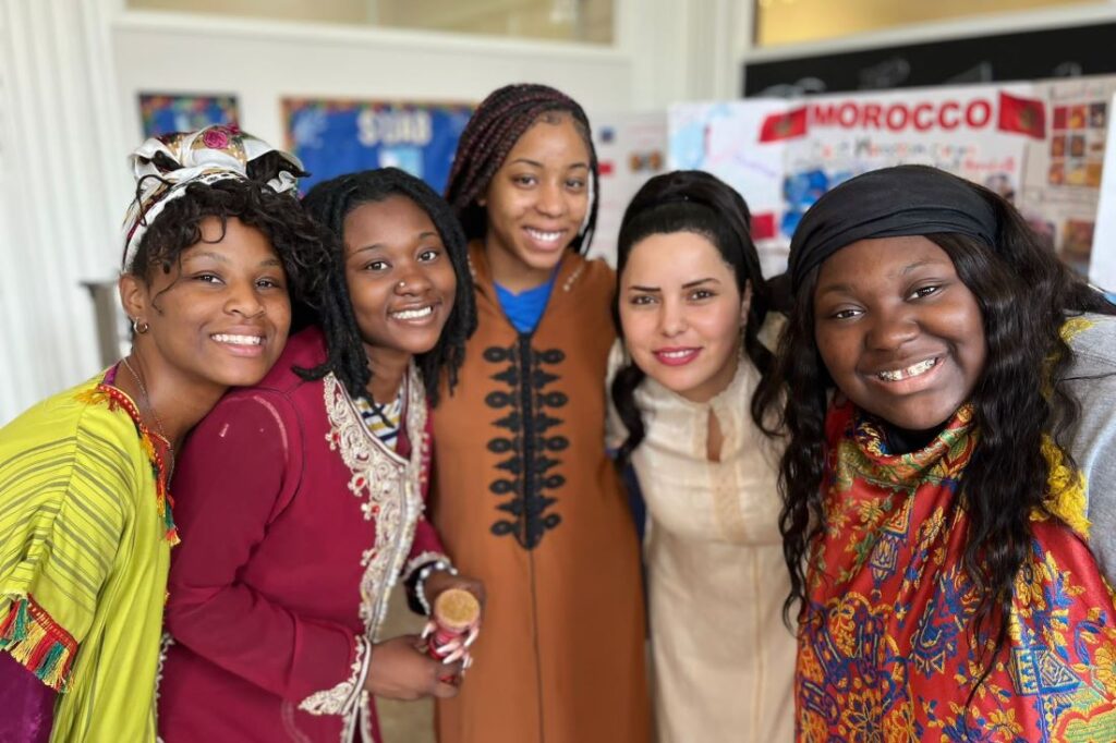 Soukaina Bakhout standing in group with Bennett College students