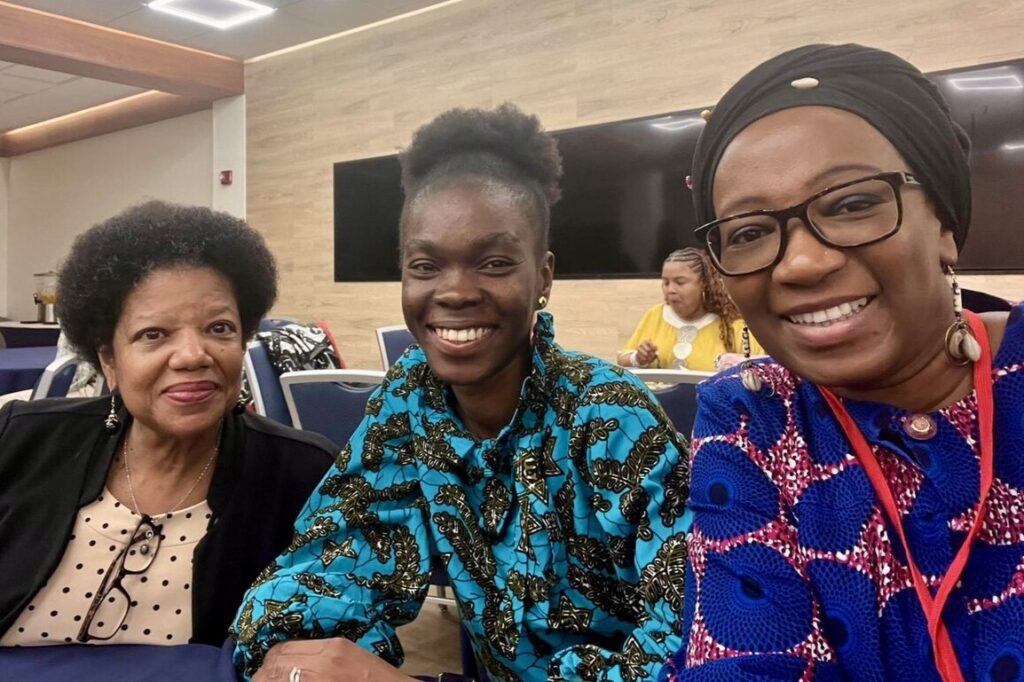 Dr. Addadzi-Koom sitting with two Howard University faculty members