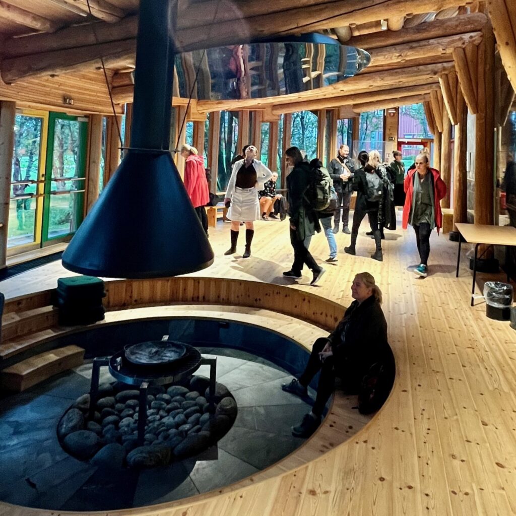 Group of scholars visiting Sámi cultural building 