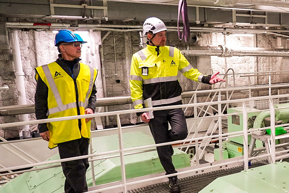 Dr. Michael Sfraga being given a tour of inside Icebreaker Polaris by other person