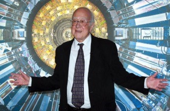 Higgs stands in front of a large circular structure with colorful, metallic details.